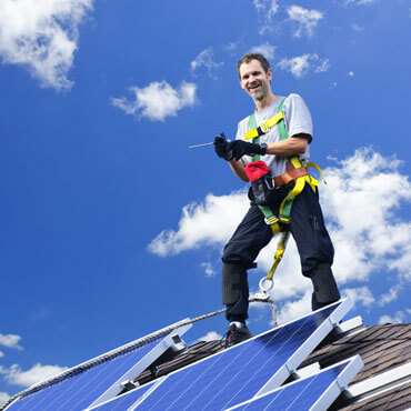 a strong roofer doing his work