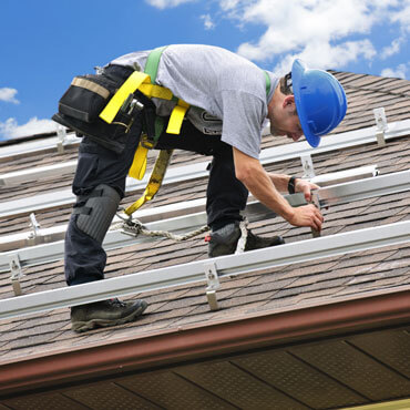 a strong roofer doing complex roofing service
